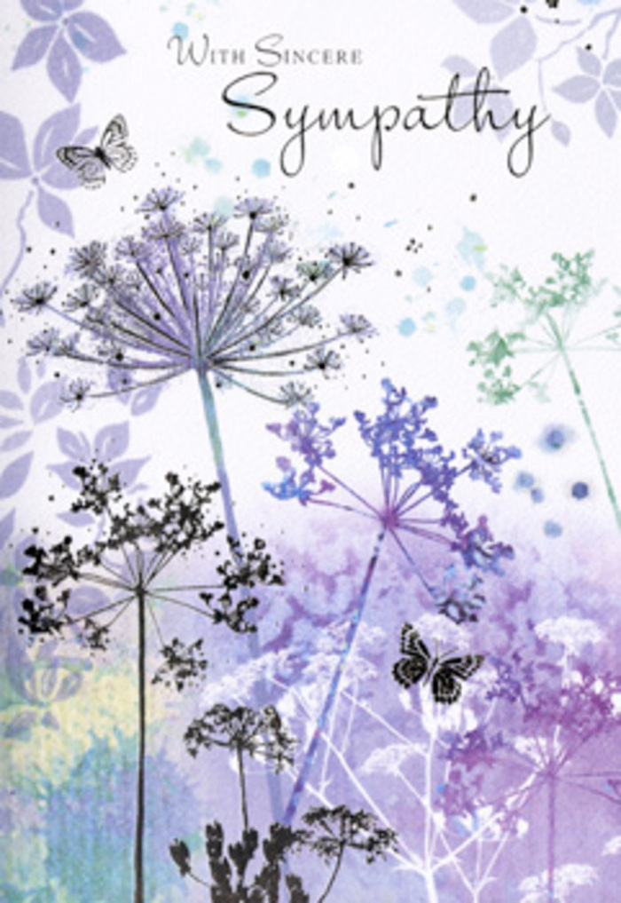 There is a serene, almost meditative elegance to this sympathy card, the kind of imagery you might imagine while pausing on a bench near Hilly Fields, thinking of someone dear. Tall, fine stems of umbelliferous wildflowers rise vertically across the design, their lines slim yet assured. Each stem ends in a delicate spray of miniature blossoms, arranged in circular, lace-like umbels that seem to hover just above the paper. The artist has used subdued shades of lavender, dusty purple, cool blue, and muted green, laid down in translucent layers that gently overlap. These colours never clash; instead, they dissolve softly into one another, giving the impression of early morning mist settling over a patch of meadow not far from Crofton Park. The background is a gentle blur of watercolour-a wash of pale violet merging into grey-blue and hints of sage-so that nothing distracts from the intricate floral silhouettes. Within this tranquil scene, a couple of butterflies drift lightly between the stems, their wings rendered with only the faintest suggestion of colour, like impressions left by a passing touch rather than fully detailed forms. This subtle movement brings life to the still composition, suggesting that even in sorrow, there is continuity and the delicate presence of memory. The lighting feels diffuse and soft, with no harsh highlights, as if the scene is lit by an overcast sky that quiets the mind. The spacious layout and restrained palette together create a respectful, comforting image-an ideal companion to condolence flowers from Crofton Park Flowers when sending sympathy to a family in the local area.