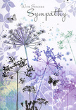 This sympathy card offers a gently painted sanctuary, reminiscent of the calm pockets of greenery dotted around Crofton Park where wildflowers nod quietly in the breeze. The main focus is a series of slender, slightly arching stems of umbelliferous blooms, each topped with a circular spray of tiny, dot-like blossoms that fan outward in fine filigree patterns. The flowers are depicted in layered tones of lavender, heather purple, soft blue, and muted sea-green, all applied with a light watercolour touch that allows edges to blur and colours to mingle. This gives the design a hazy, atmospheric feel, as though you're looking at the scene through a light veil of mist. The background is composed of gentle washes of purple and grey-green that rise and fall in soft gradients, evoking an abstract sky and field without defining them too sharply-much like catching a distant glimpse of foliage beyond a row of houses near Crofton Park Road. Scattered among the stems, a few butterflies hover with wings barely traced in pale colour, offering a quiet suggestion of movement and a sense of visiting spirits or loving thoughts drifting close. Their presence adds warmth to the otherwise still composition, balancing the calmness with a hint of life. The overall mood is tender, reflective, and dignified, with ample space around the flowers that invites personal interpretation and memory. It's the sort of card someone in Crofton Park might choose to accompany a simple wreath or hand-tied sympathy bouquet, conveying heartfelt condolences through a subtle, nature-inspired scene rather than elaborate decoration.